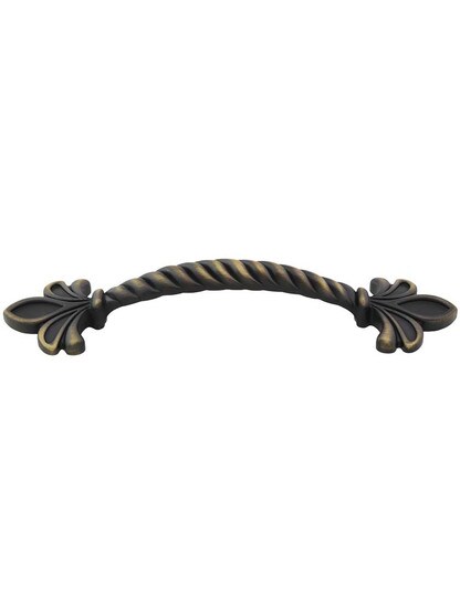 Evangeline 6 1/2 inch Overall Length Zinc Die Cast Fleur De Lis Cabinet Pull in Antique Brushed Satin Brass.